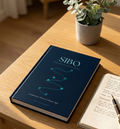 SIBO Education + Action System — photographie éditoriale, livre sur bureau avec carnet et plante